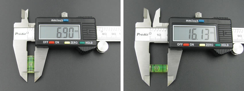 There is a plastic tubular level vial of 7 mm diameter and 16 mm length.